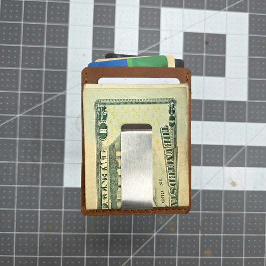 Money clip with cash on a grid background