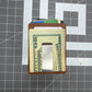 Money clip with cash on a grid background